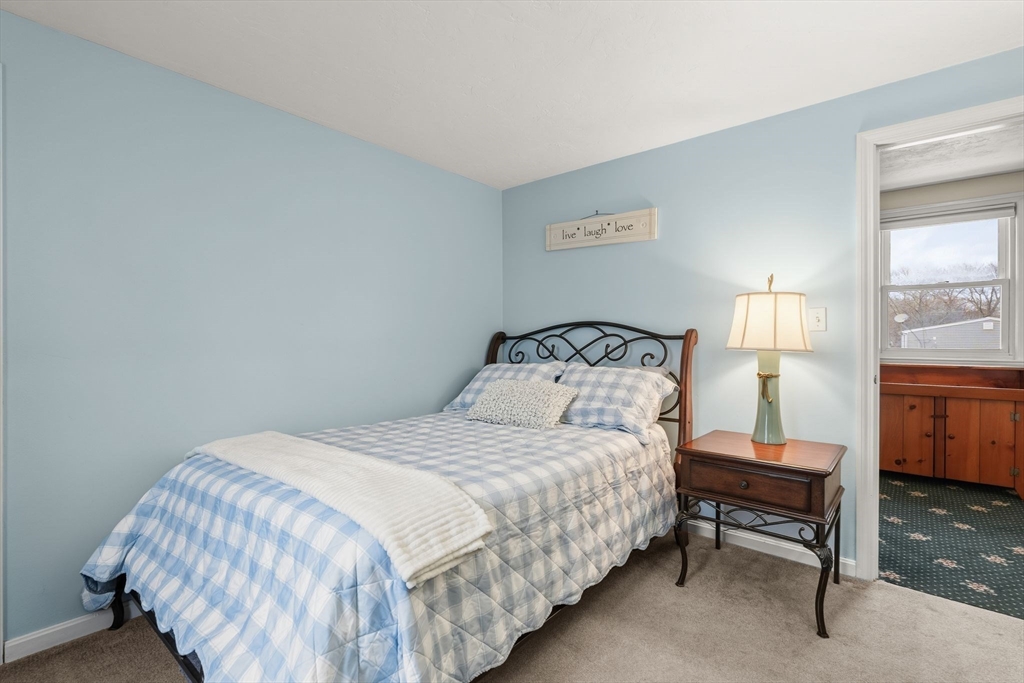 19 Overlook Road Holbrook, MA 02343 - Photo 25 of 42 a bedroom with a bed and a lamp
