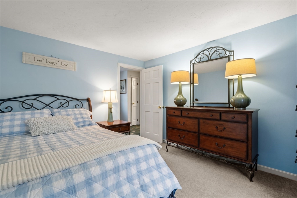 19 Overlook Road Holbrook, MA 02343 - Photo 26 of 42 a bedroom with a bed and a dresser in it