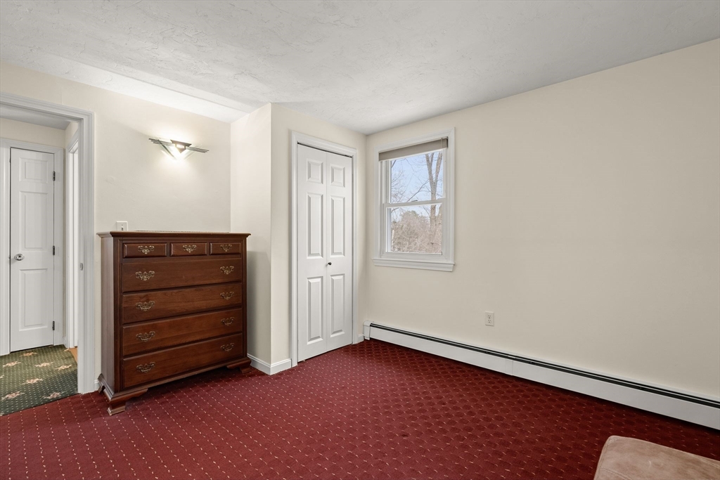 19 Overlook Road Holbrook, MA 02343 - Photo 28 of 42 an empty room with a dresser