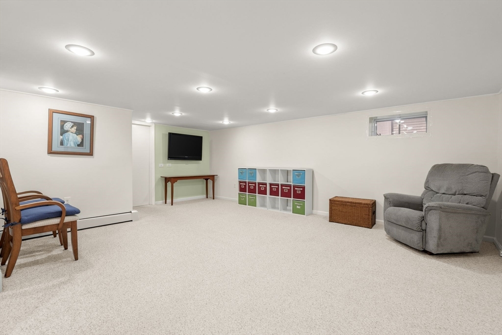 19 Overlook Road Holbrook, MA 02343 - Photo 30 of 42 a living room with furniture and a flat screen tv