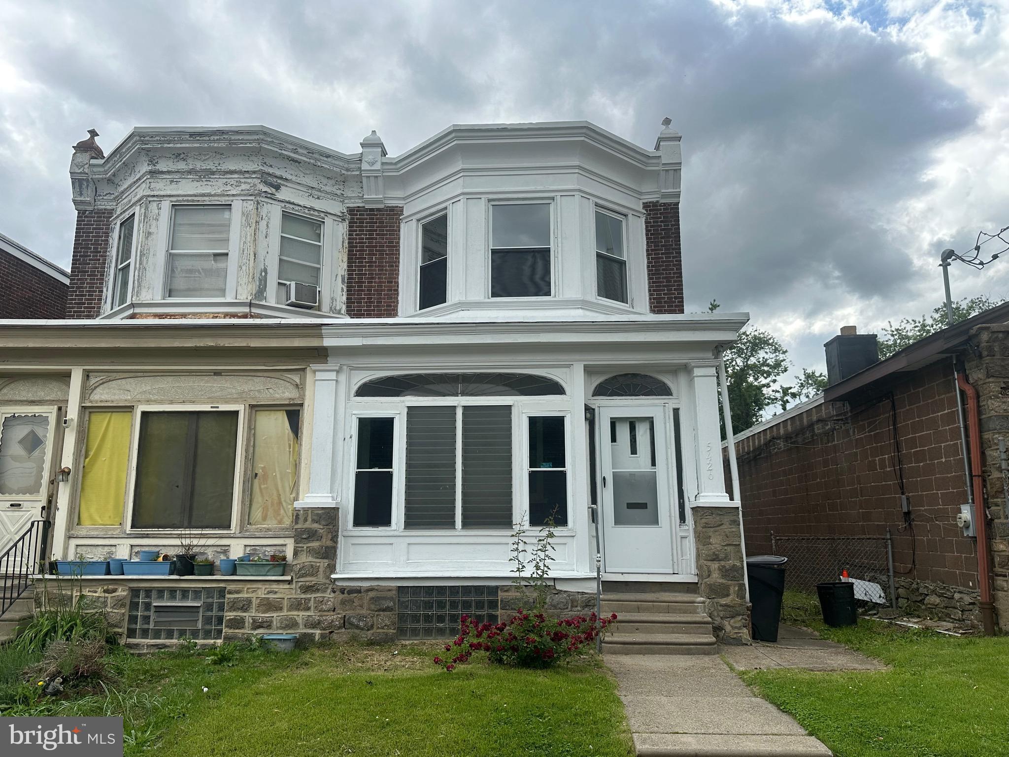 5426 North Front Street Philadelphia, PA 19120 - Photo 1 of 23 a front view of a house with a yard