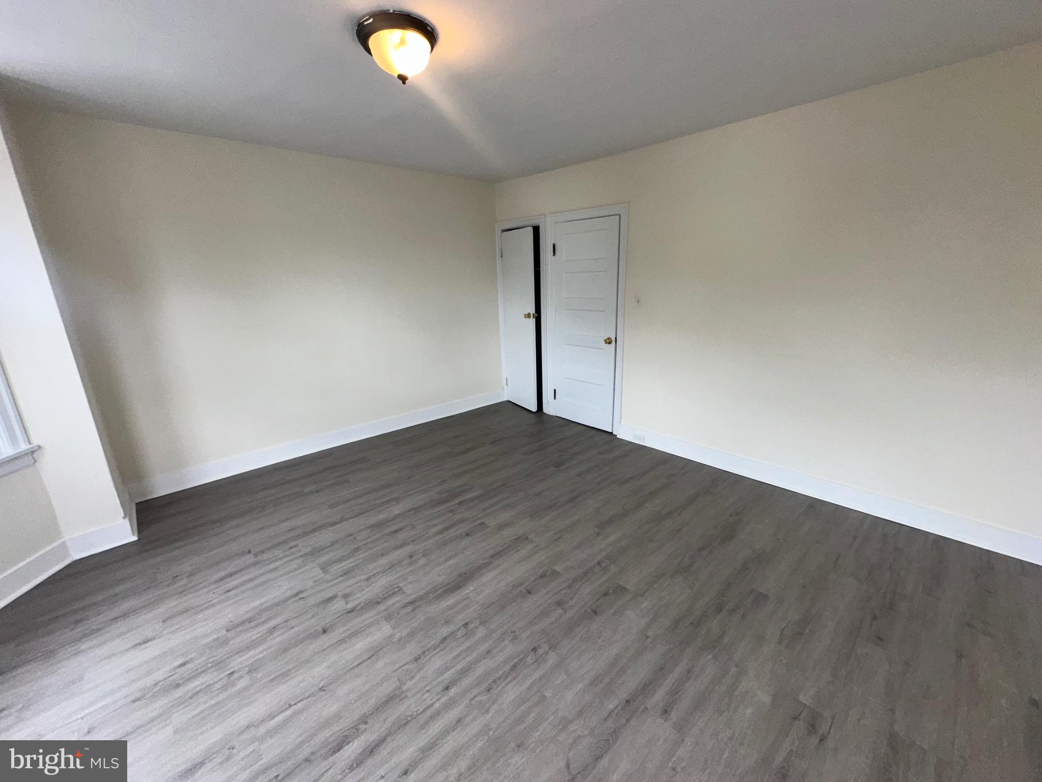 5426 North Front Street Philadelphia, PA 19120 - Photo 21 of 23 an empty room with wooden floor and windows