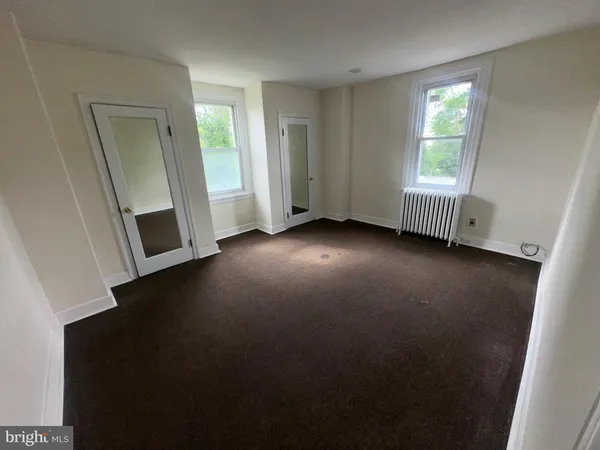 a view of a room that has a window in it