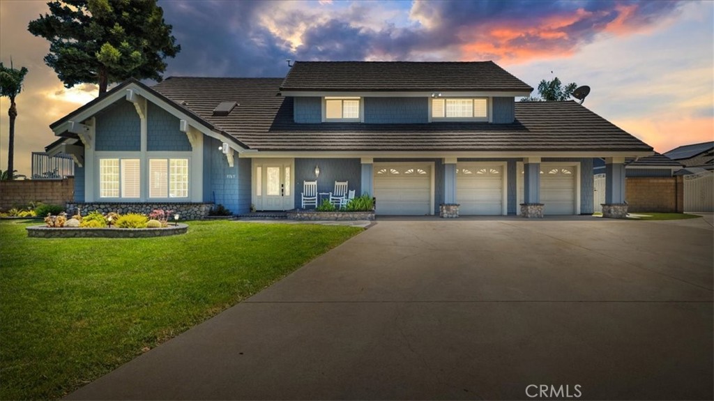 9765 Carrari Street Rancho Cucamonga, CA 91737 - Photo 1 of 1 a front view of a house with a yard and porch