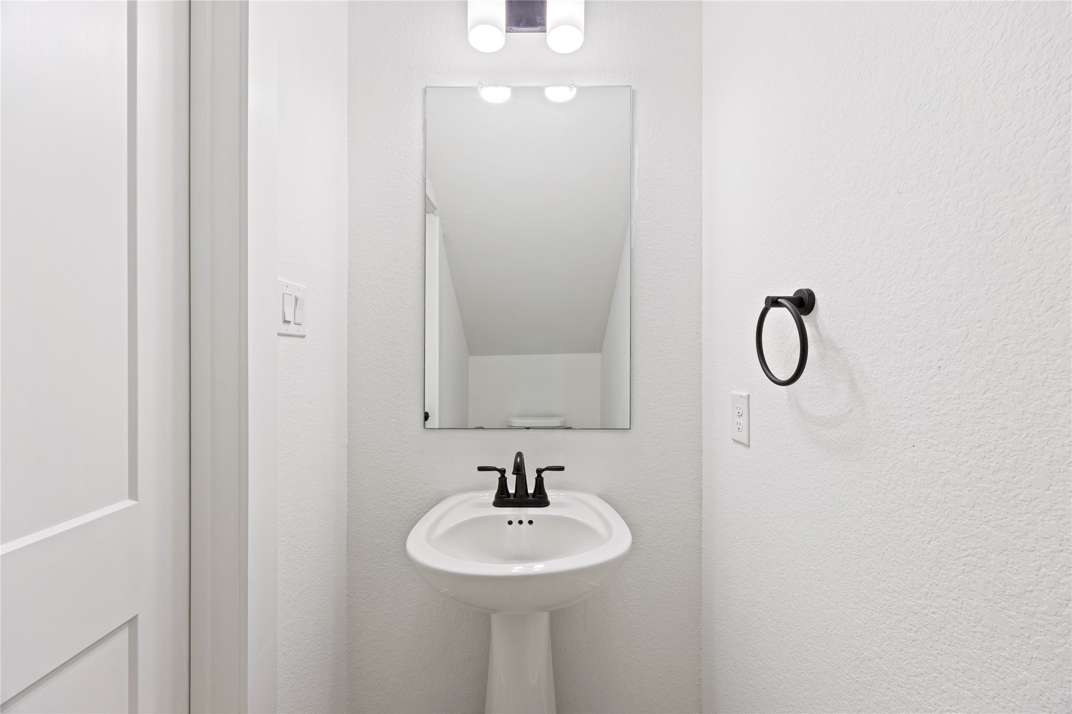 10636 Wild Chives Conroe, TX 77385 - Photo 14 of 29 a bathroom with a sink a mirror and a shower