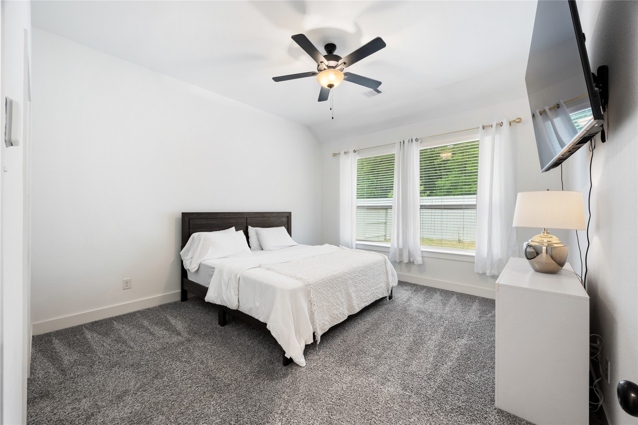 10636 Wild Chives Conroe, TX 77385 - Photo 15 of 29 a bedroom with a bed and window