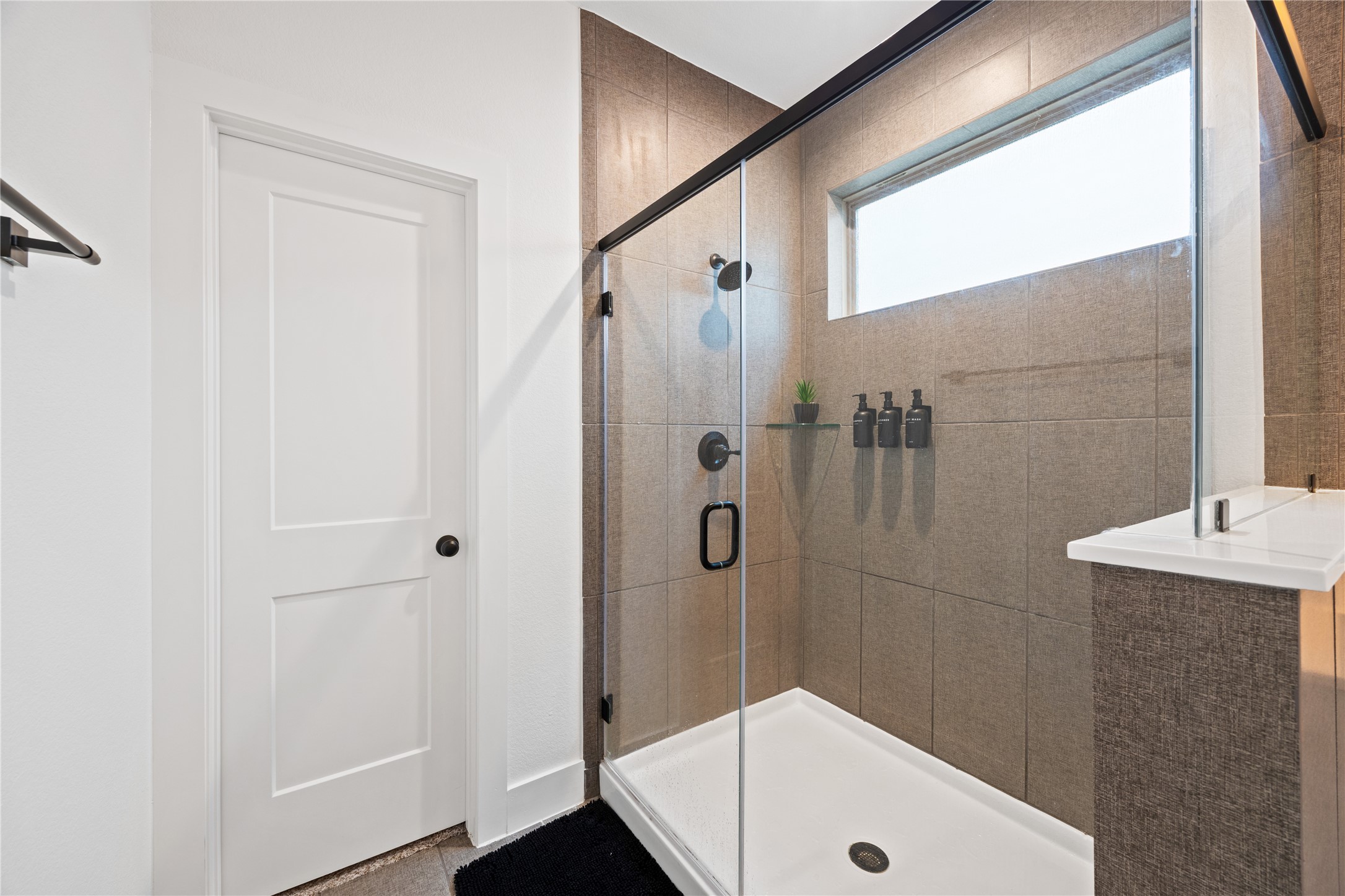 10636 Wild Chives Conroe, TX 77385 - Photo 18 of 29 a bathroom with a tub and a shower