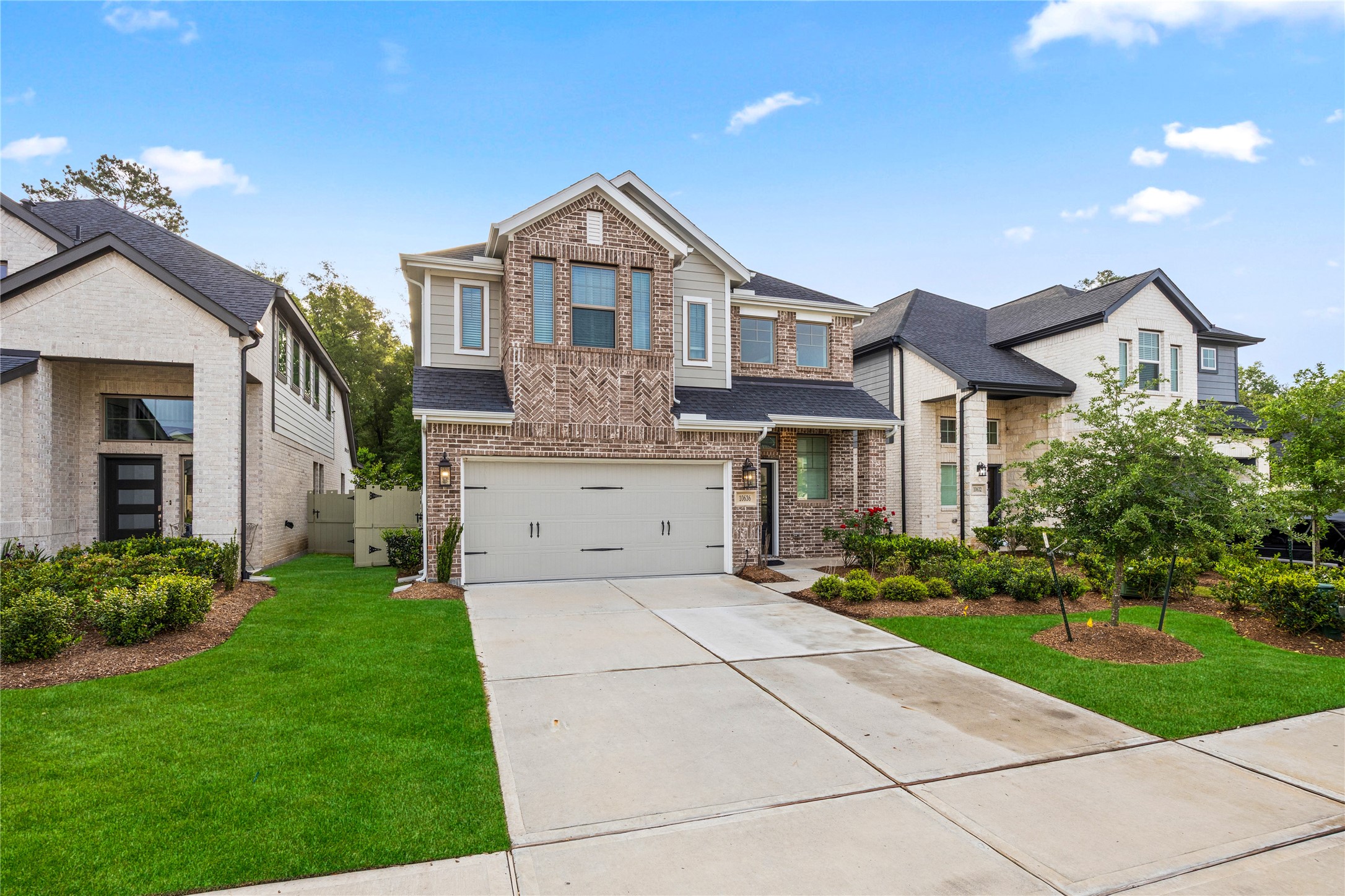 10636 Wild Chives Conroe, TX 77385 - Photo 2 of 29 a front view of a house with a yard