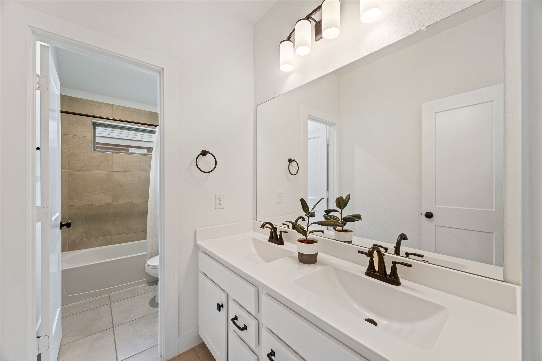 10636 Wild Chives Conroe, TX 77385 - Photo 21 of 29 a bathroom with a sink double vanity and shower