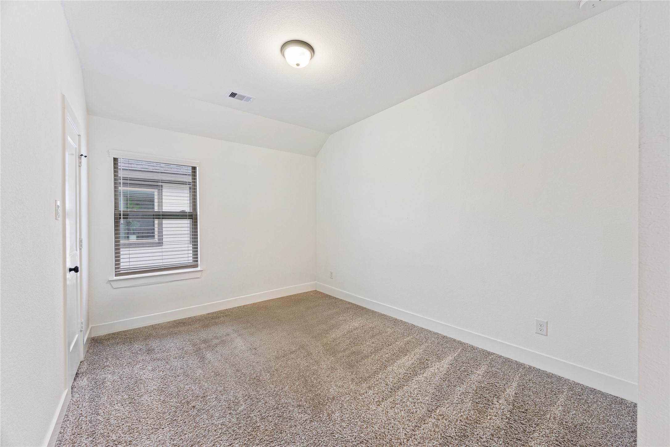 10636 Wild Chives Conroe, TX 77385 - Photo 22 of 29 an empty room with windows