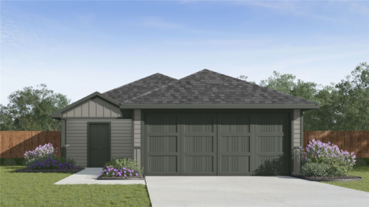1625 Letty Lane Corpus Christi, TX 78418 - Photo 1 of 7 a front view of a house with a yard and garage