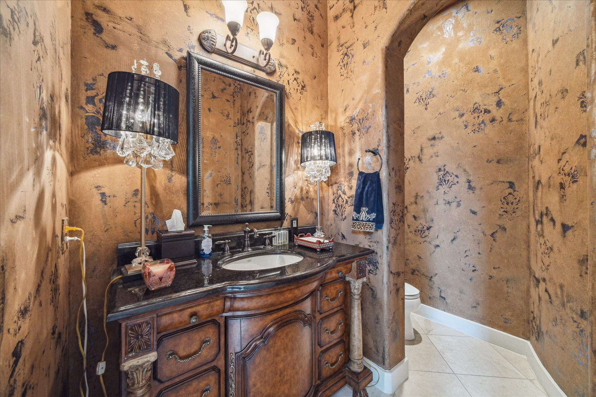 3319 Bridgeberry Lane Houston, TX 77082 - Photo 17 of 50 First floor powder bath with faux finished walls, custom vanity cabinet and separate water closet.