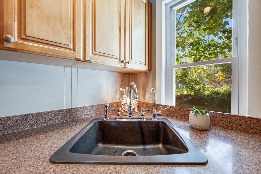 98 Reed Street Cambridge, MA 02140 - Photo 13 of 32 a kitchen with a sink and cabinet