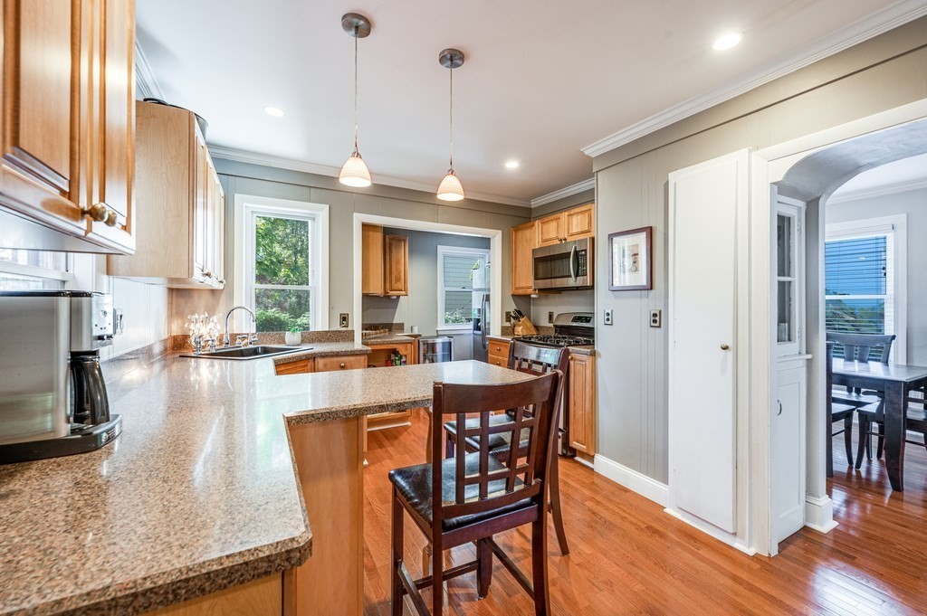 98 Reed Street Cambridge, MA 02140 - Photo 16 of 32 a large kitchen with a table and chairs