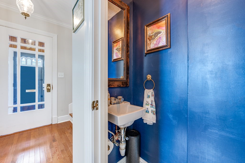 98 Reed Street Cambridge, MA 02140 - Photo 17 of 32 a view of staircase with a sink and mirror