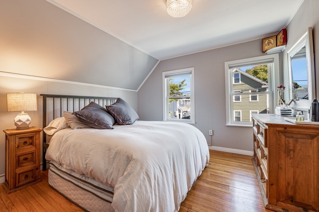 98 Reed Street Cambridge, MA 02140 - Photo 19 of 32 a bedroom with a bed and window