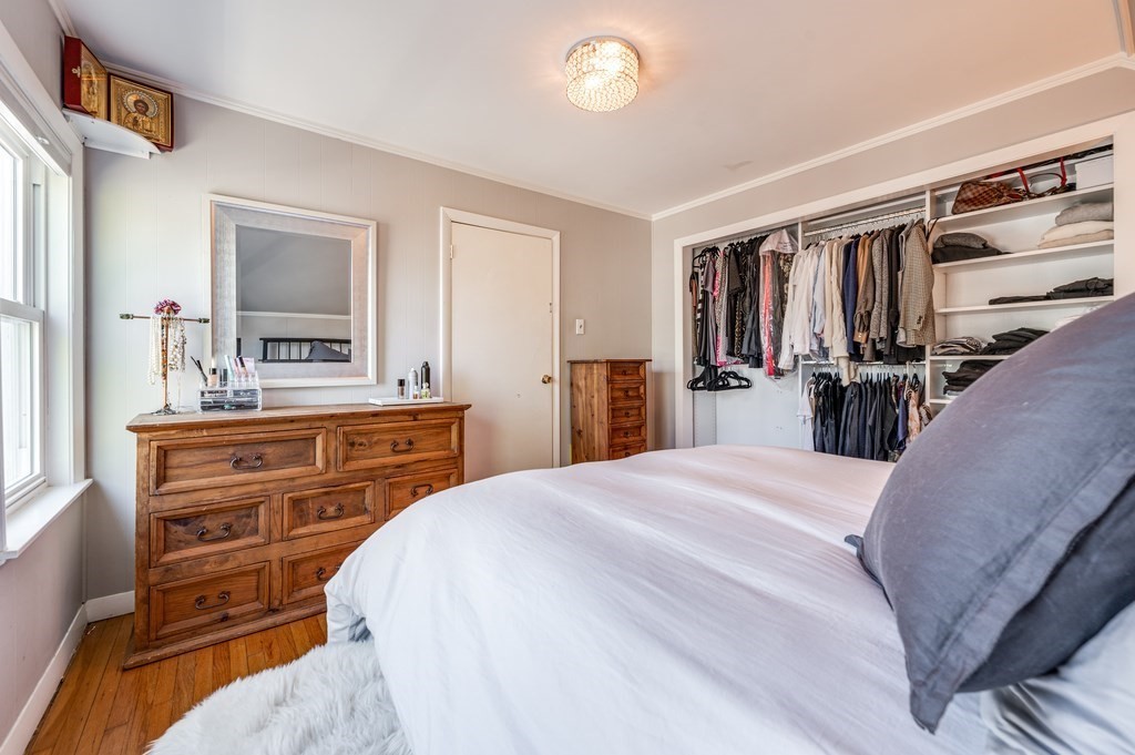 98 Reed Street Cambridge, MA 02140 - Photo 20 of 32 a bedroom with a bed and a large mirror