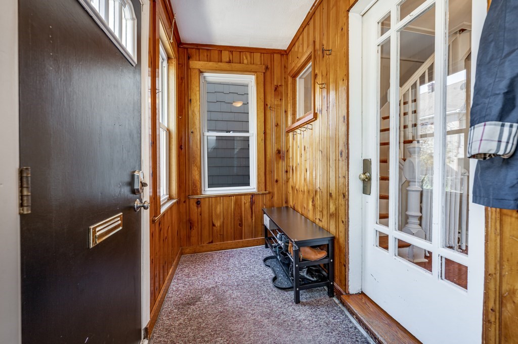 98 Reed Street Cambridge, MA 02140 - Photo 2 of 32 a view of a balcony with chair and brick walls