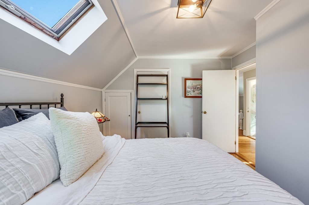 98 Reed Street Cambridge, MA 02140 - Photo 23 of 32 a bedroom with a bed and a window