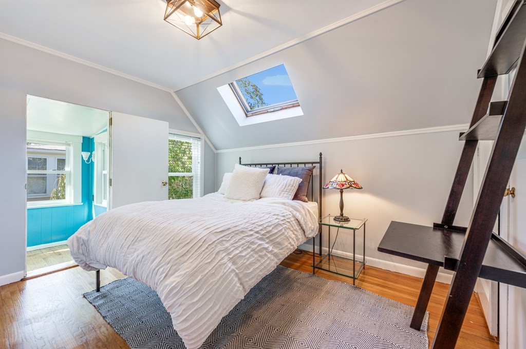 98 Reed Street Cambridge, MA 02140 - Photo 24 of 32 a bedroom with a bed and a window