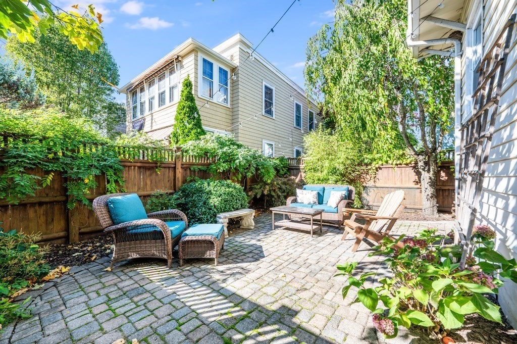 98 Reed Street Cambridge, MA 02140 - Photo 28 of 32 a backyard of a house with seating space
