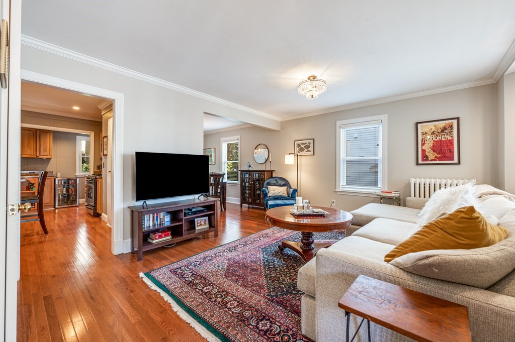 98 Reed Street Cambridge, MA 02140 - Photo 3 of 32 a living room with furniture and a flat screen tv