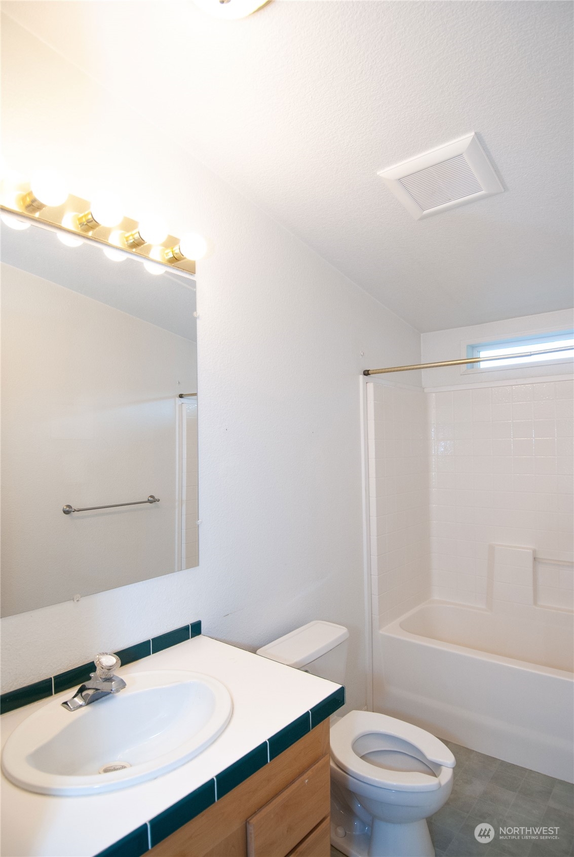 15400 Southeast 155th Place, Unit 12 Renton, WA 98058 - Photo 12 of 21 a bathroom with a sink toilet and shower