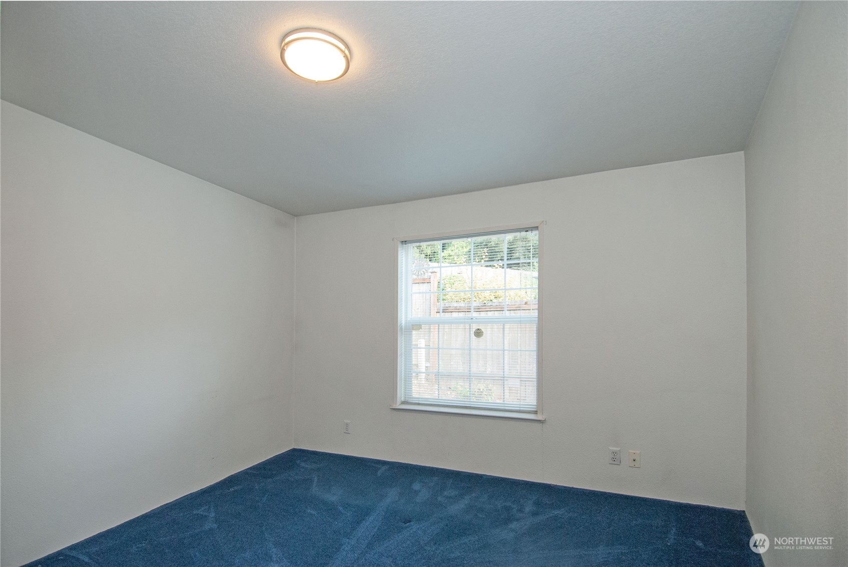 15400 Southeast 155th Place, Unit 12 Renton, WA 98058 - Photo 13 of 21 an empty room with a window