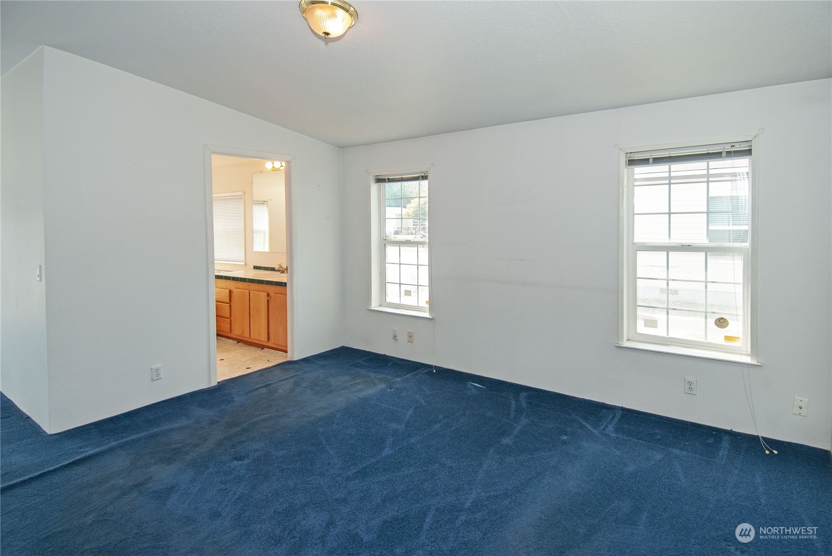 15400 Southeast 155th Place, Unit 12 Renton, WA 98058 - Photo 17 of 21 an empty room with windows