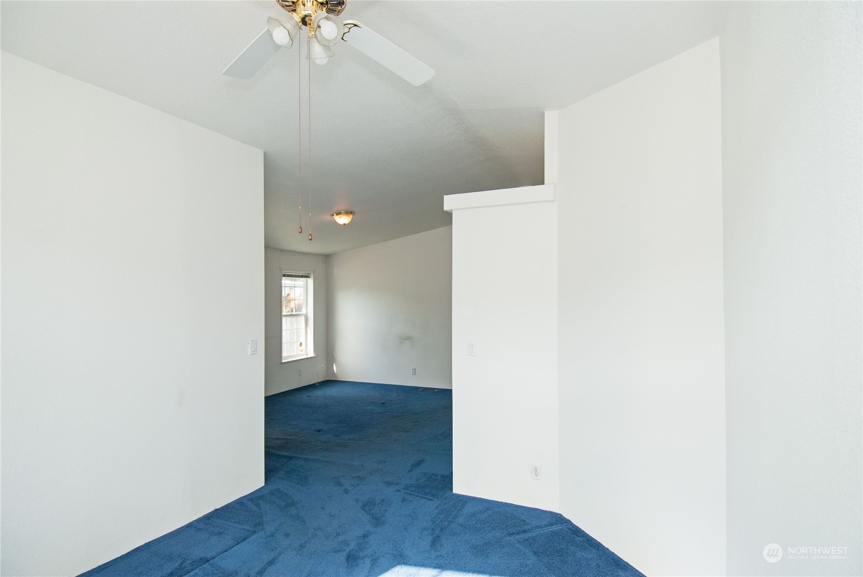 15400 Southeast 155th Place, Unit 12 Renton, WA 98058 - Photo 19 of 21 a view of an empty room with a chandelier fan