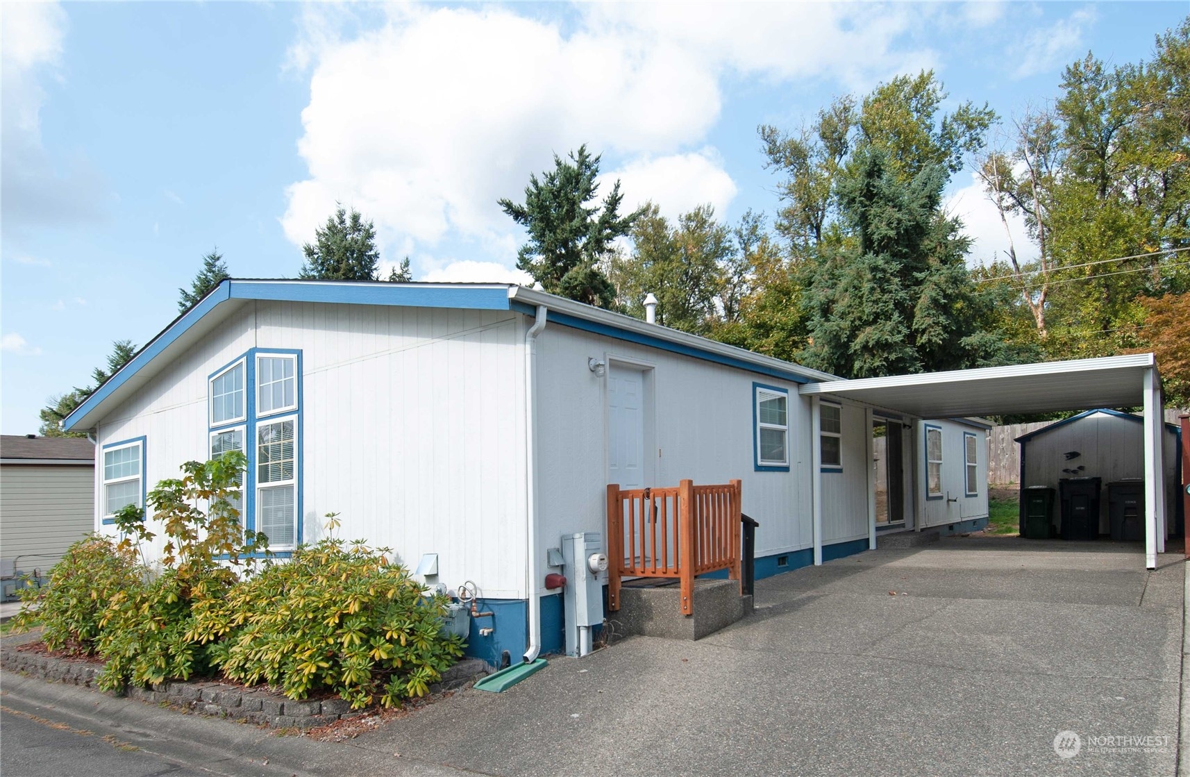 15400 Southeast 155th Place, Unit 12 Renton, WA 98058 - Photo 2 of 21 a view of a house with a yard and garage