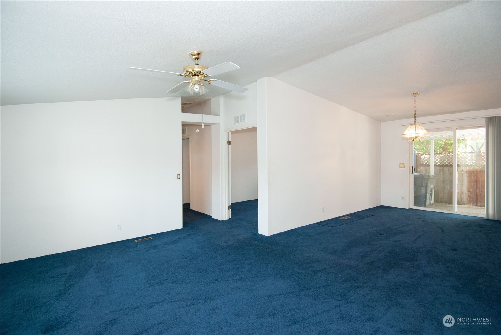 15400 Southeast 155th Place, Unit 12 Renton, WA 98058 - Photo 4 of 21 an empty room with closet and a ceiling fan
