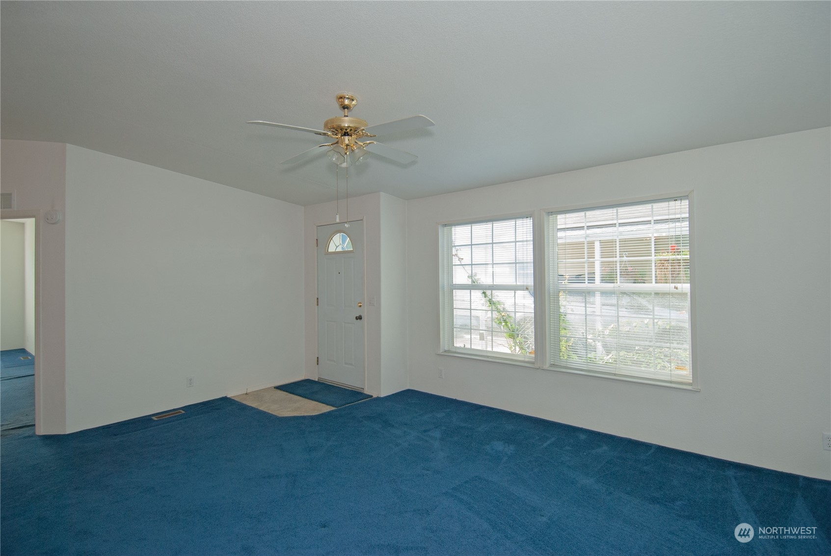 15400 Southeast 155th Place, Unit 12 Renton, WA 98058 - Photo 6 of 21 an empty room with windows and fan