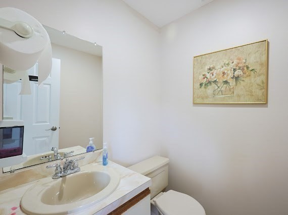 14 Shaw Farm Road, Unit 14 Canton, MA 02021 - Photo 34 of 34 a bathroom with a sink mirror and toilet
