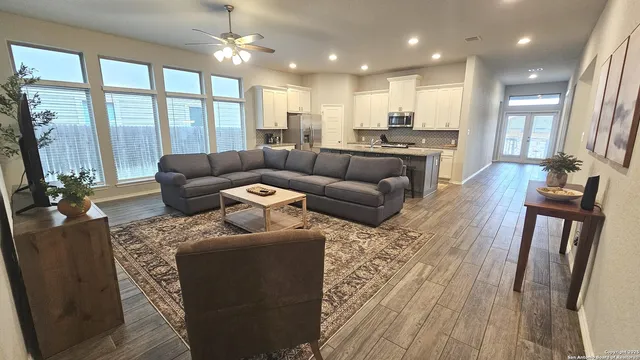 a living room with furniture and a large window