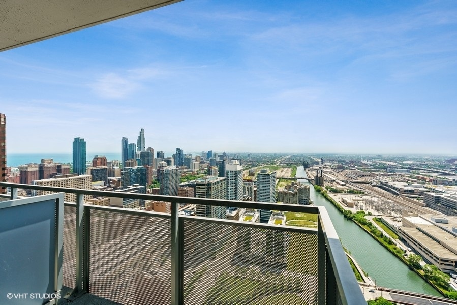 235 West Van Buren Street, Unit 4409 Chicago, IL 60607 - Photo 17 of 26 a view of a city from a balcony