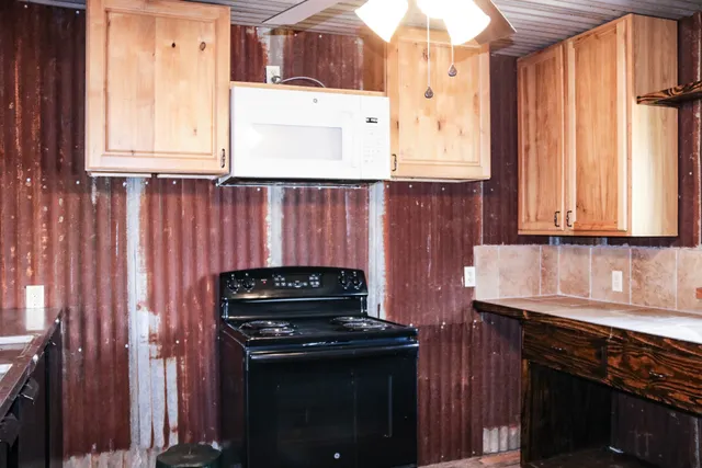 a living room with furniture and flowers