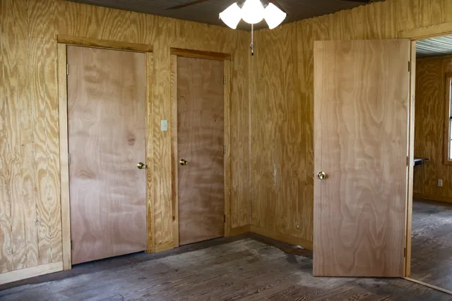a bathroom with a sink a toilet and shower curtain