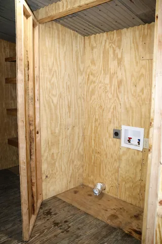 a view of backyard with a garden and deck