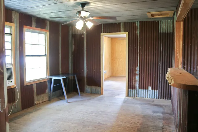 a kitchen with a sink cabinets and window