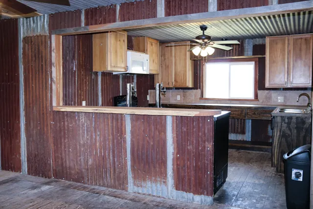 a view of a porch of a house with wooden floor