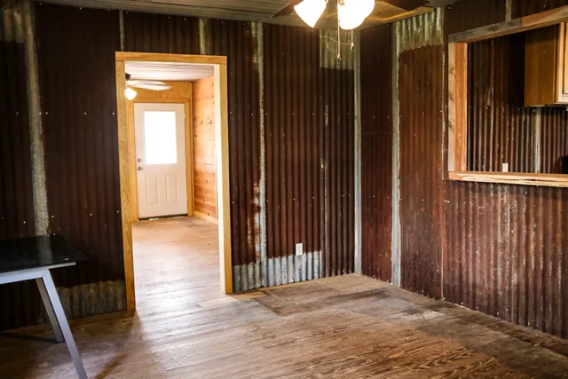 a kitchen with a stove a sink and a microwave