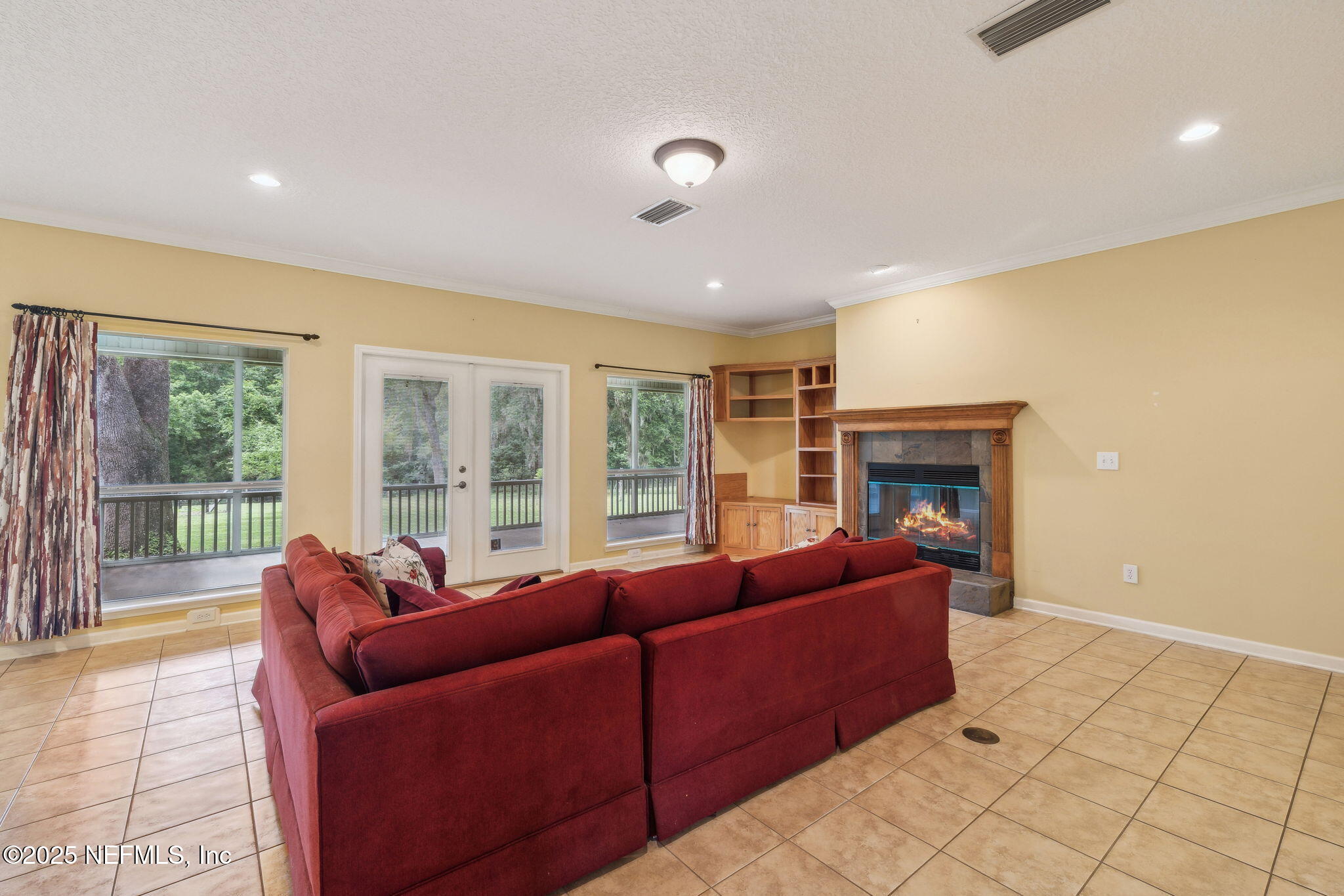 5802 Manning Cemetery Road Jacksonville, FL 32234 - Photo 16 of 117 a living room with furniture and a fireplace