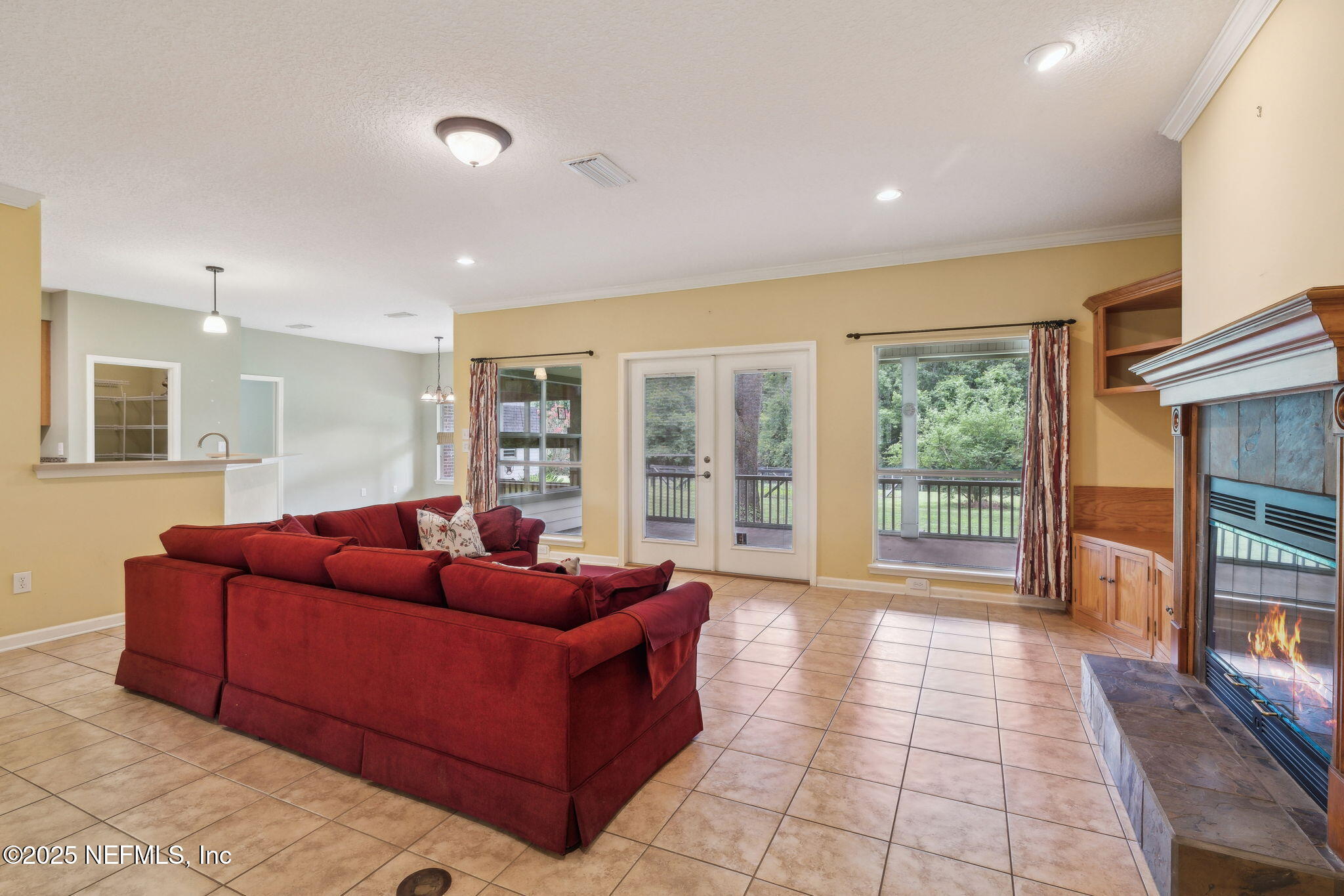 5802 Manning Cemetery Road Jacksonville, FL 32234 - Photo 19 of 117 a living room with furniture and a floor to ceiling window