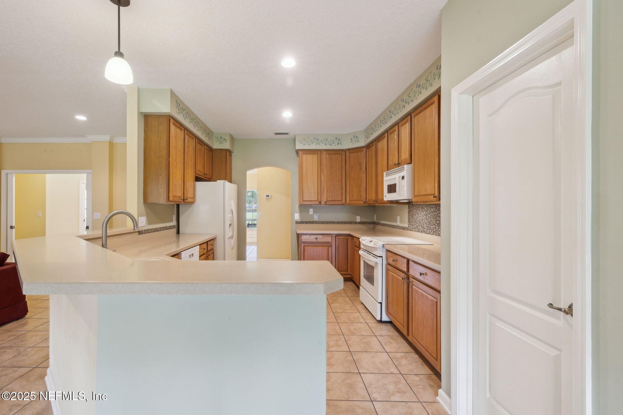 5802 Manning Cemetery Road Jacksonville, FL 32234 - Photo 23 of 117 a kitchen with stainless steel appliances granite countertop a sink a stove and a refrigerator