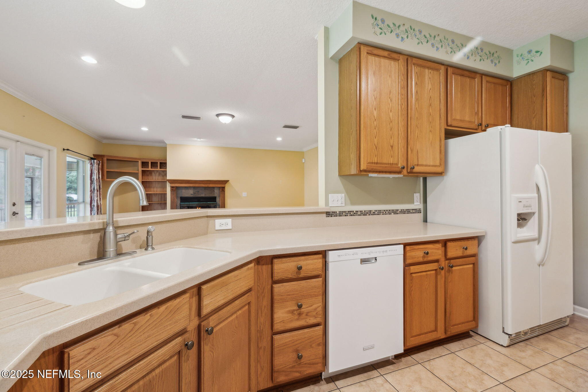 5802 Manning Cemetery Road Jacksonville, FL 32234 - Photo 24 of 117 a kitchen with stainless steel appliances granite countertop a sink and a refrigerator