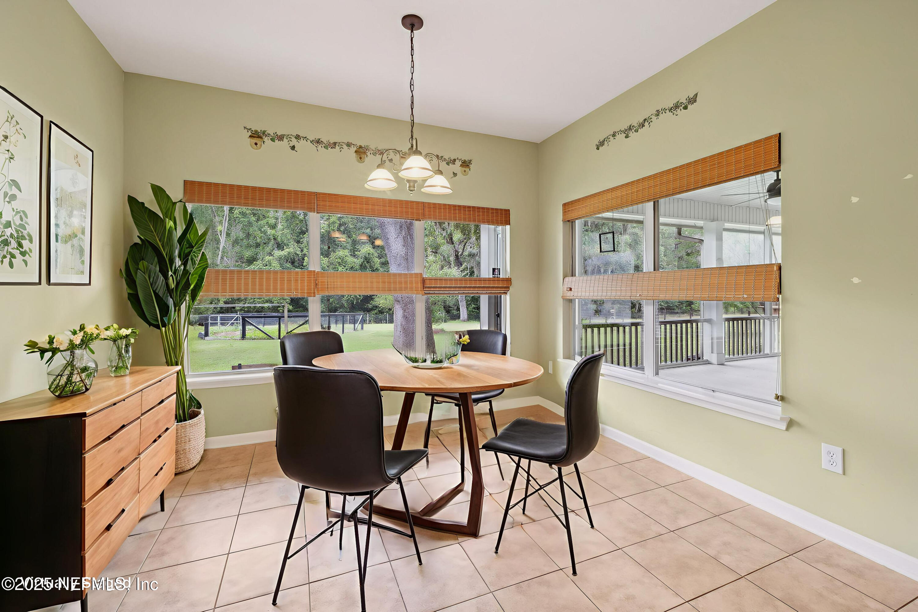 5802 Manning Cemetery Road Jacksonville, FL 32234 - Photo 38 of 117 a view of a dining room with furniture window and outside view