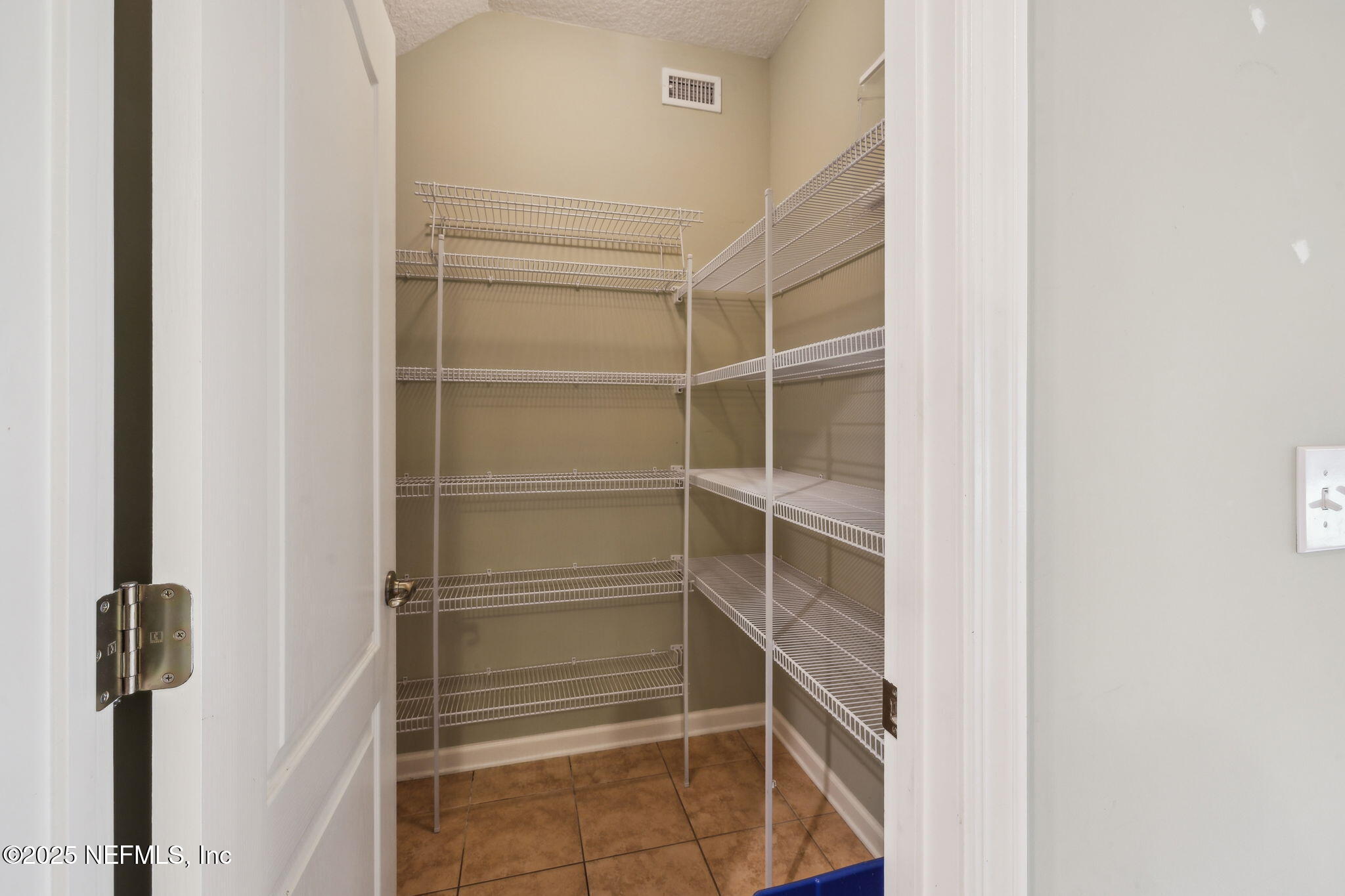 5802 Manning Cemetery Road Jacksonville, FL 32234 - Photo 41 of 117 a view of walk in closet with empty racks