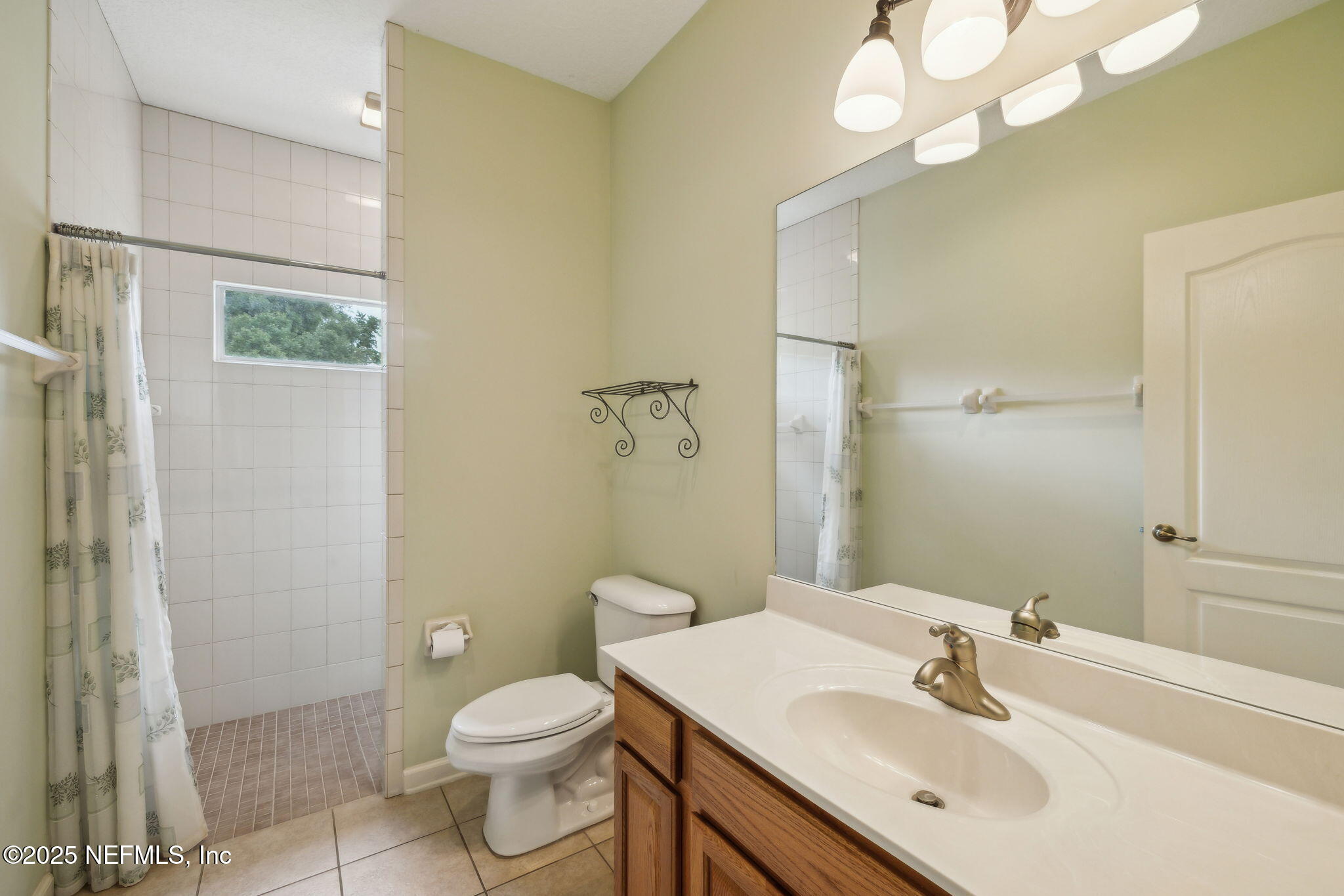 5802 Manning Cemetery Road Jacksonville, FL 32234 - Photo 45 of 117 a bathroom with a sink a toilet and shower