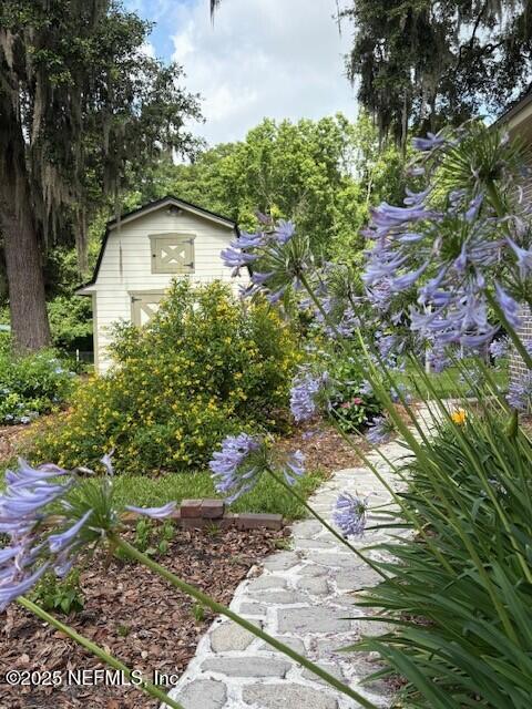 5802 Manning Cemetery Road Jacksonville, FL 32234 - Photo 5 of 117 a front view of a house with a yard and garage